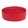 Origin8 Pro Cork Handlebar Tape shown as a close-up of a red roll, designed for secure grip on bike or tool handles, featuring shock absorption and adhesive backing for easy application.