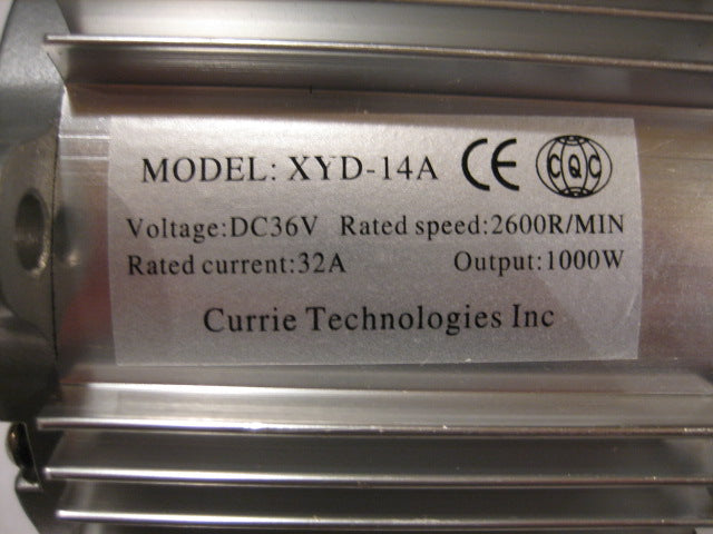 Close-up of a metal labeled 36 Volt 1000 Watt Electric Motor with 15 Tooth #25 Chain Sprocket, featuring a standard three-hole mounting face plate.