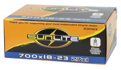 Box containing a 700x18-23 Bicycle Inner Tube with 32mm Presta Valve from Sunlite, showing visible parts and packaging.