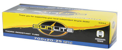 Box containing 700x20-25 (27x1) Heavy Duty Thorn Resistant Bicycle Inner Tube with Straight 32 mm Schrader Valve by Sunlite, featuring a yellow and black logo on the packaging.