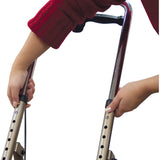 Person gripping the handle of a Drive Medical 780 Adult Knee Walker, emphasizing its sturdy frame and ergonomic design for enhanced mobility.