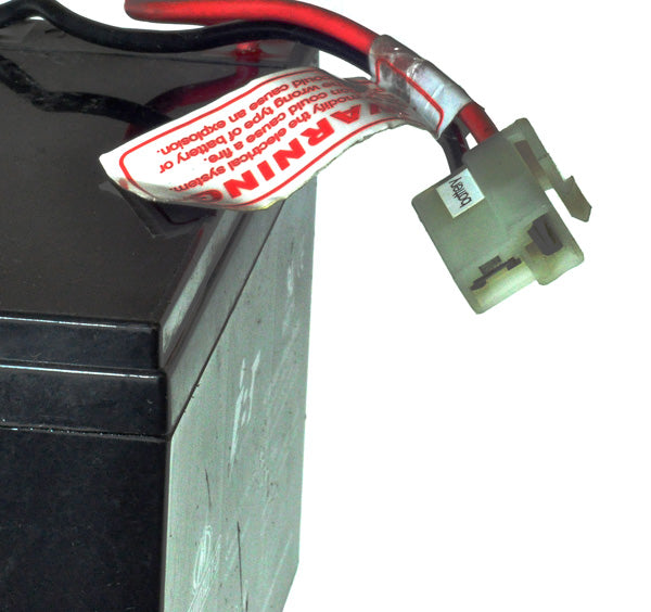 Close-up of a sealed lead acid (SLA) absorbed glass mat (AGM) 7 Ah 12 Volt Battery for the Minimoto Hybrid electric bicycle, showing terminal harness and connector.