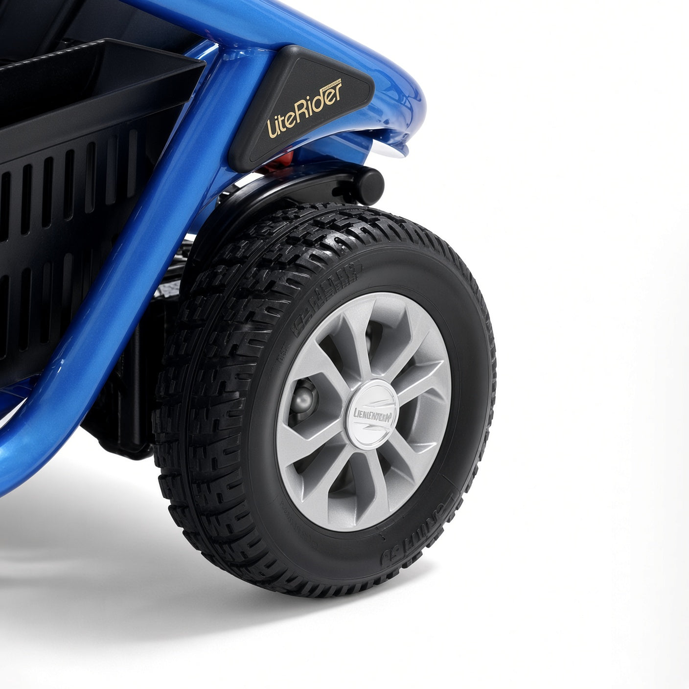 MBW-LTRD-MAG-AL rear wheel installed on a blue Golden LiteRider mobility scooter, close-up of the rear corner