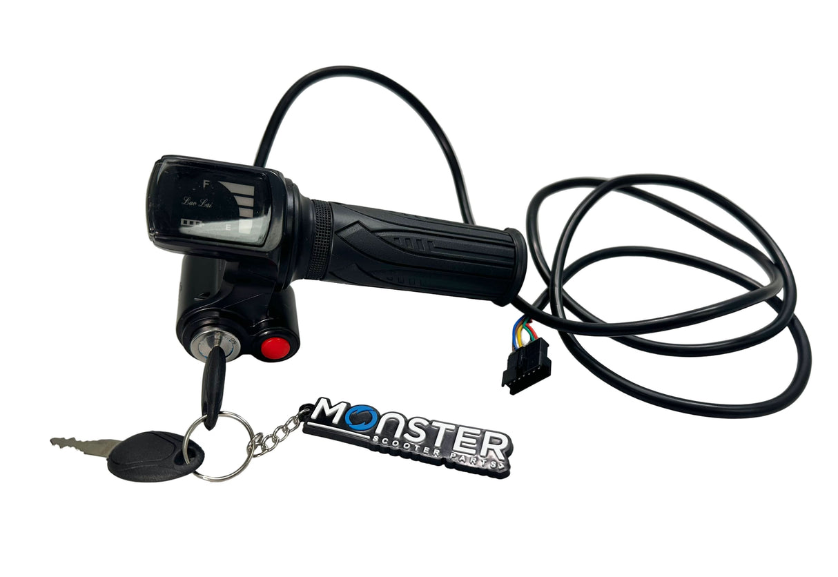 Black scooter throttle with key and 'Monster' keychain on a white surface