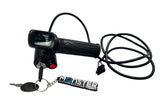 Black scooter throttle with key and 'Monster' keychain on a white surface