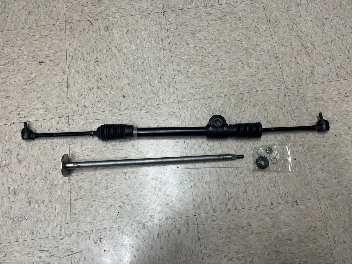 Steering Gear Assembly for the Coleman KT196 196cc 6.5 Hp Go-Kart (Blemished) showing metal rods, screws, and a black pipe on a tile floor.