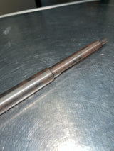 9.20 Sprocket Shaft for the Realtree RTK200 196cc Go-Kart (Blemished) shown on a metal surface, highlighting its stepped rod design and threaded end. Minor surface rust visible.