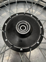 14 (2.50-14) Front Wheel Assembly for Dirt Bikes (Blemished) featuring a black rim, metal spokes, and a knobby tire with wheel bearings, suitable for various 50cc dirt bike models.