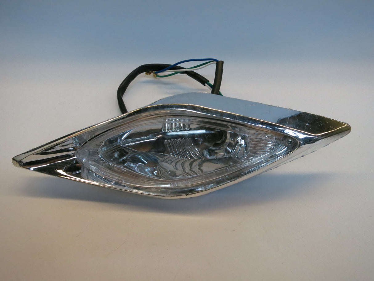 Close-up of the Headlight Assembly for 90cc Baja 90 (BA90) and Wilderness 90 (WD90) ATVs, showing the headlight with visible wires. Perfect for replacement on compatible small engine ATVs.