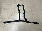 3-Point 4-Strap Seat Belt for Go-Karts (Black) on a tile floor, showing close-up details of the strong straps and adjustable buckles, highlighting the robust design and safety features.