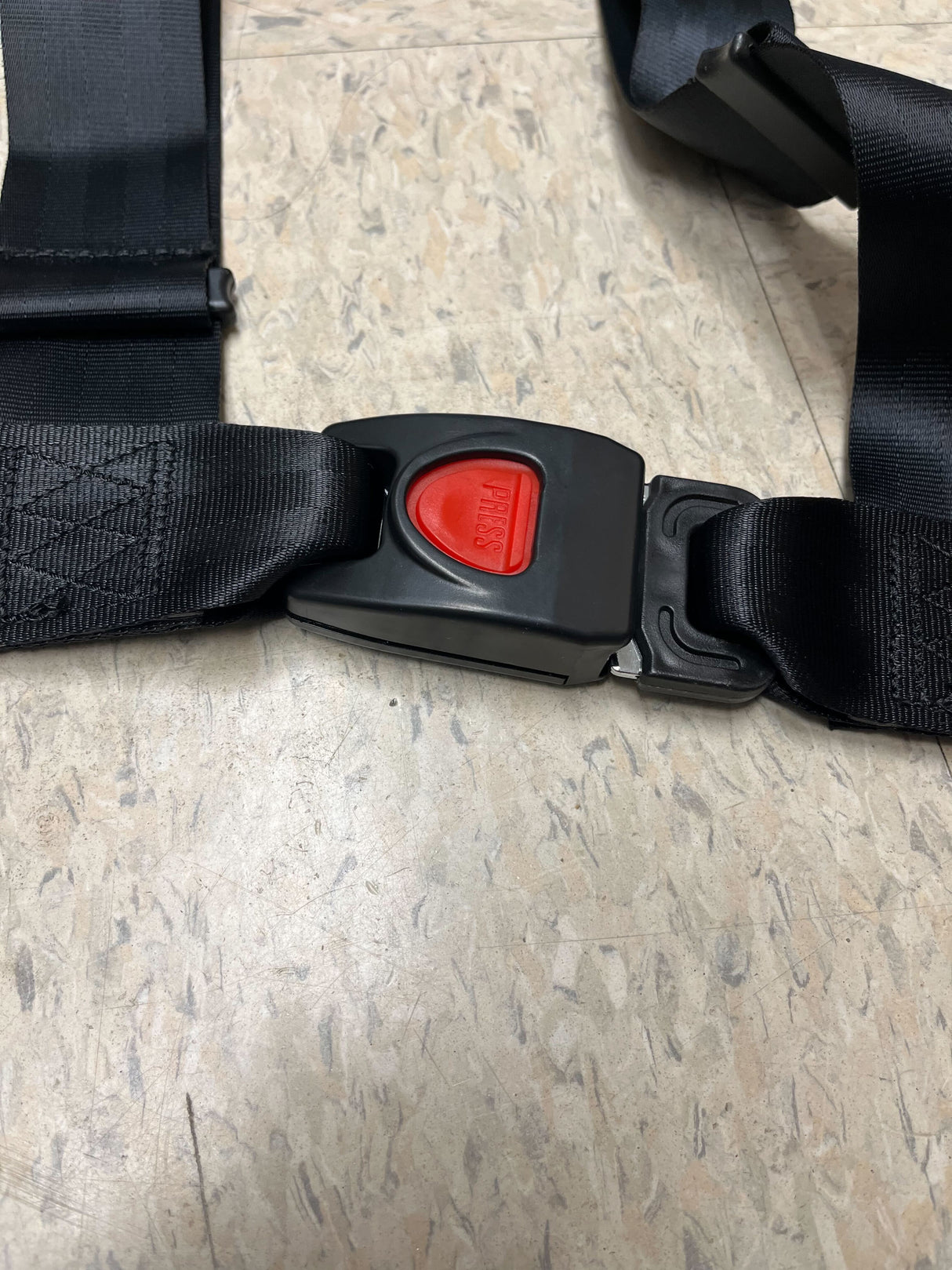 3-Point 4-Strap Seat Belt for Go-Karts (Black) (Missing Hardware) featuring a strong 3-point attachment, adjustable black straps, and a red push-button release for secure and convenient use.