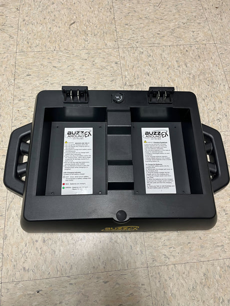 Battery Charging Dock for Golden Buzzaround EX (GB118/GB148) & Buzzaround LX (GB119/GB149) Scooters (Blemished) holding two batteries with labels, warning sign, and charging port.