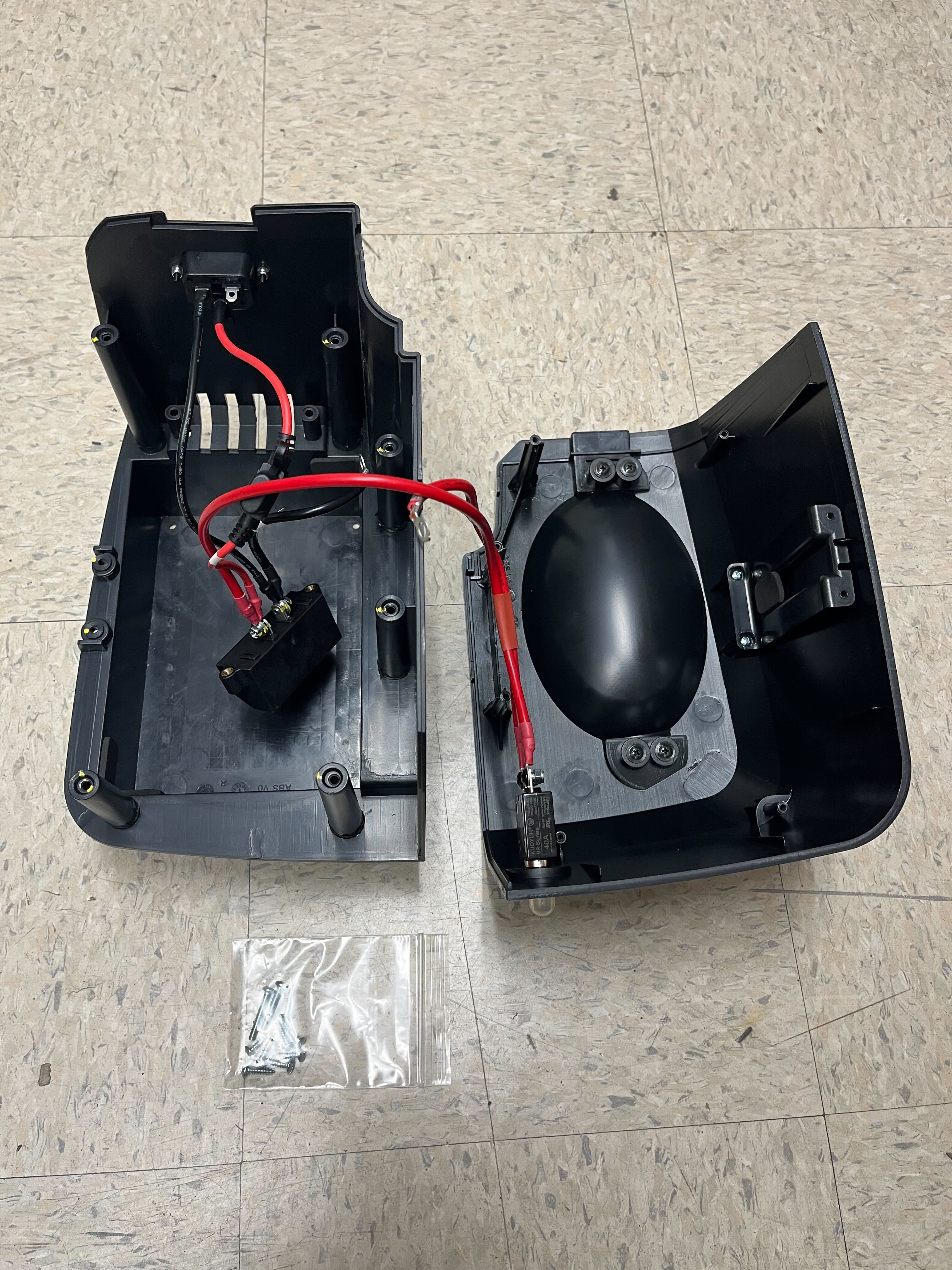 Right Battery Box Assembly for Golden Buzzaround EX (GB118/GB148) & LX (GB119/GB149) Scooters (Blemished) (No Batteries) featuring a black rectangular box with red wires and additional screws in a plastic bag.