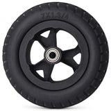 Golden Cricket Travel Power Chair Wheel - A black rubber wheel with a multi-spoke hub and a visible silver ball bearing in the center, photographed on a clean white background. The tire size '7X1.