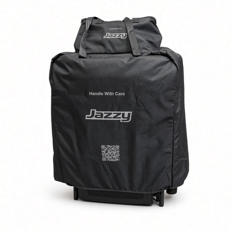 Travel bag kit for the Jazzy Carbon and Jazzy Ultra Light fitted over a folded power chair, with the battery bag attached on top
