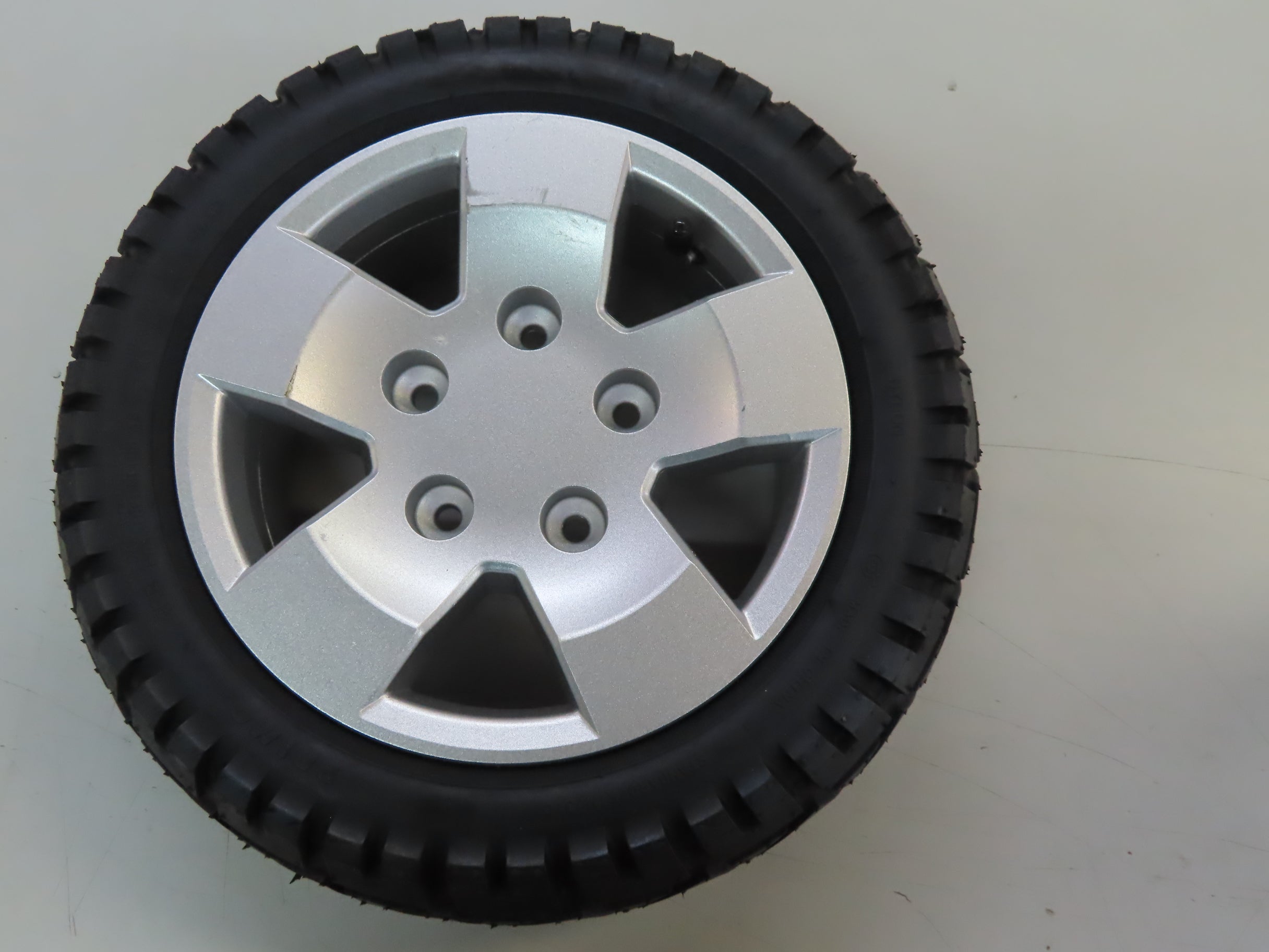 13x4 Low Profile Pneumatic Wheel Assembly for Pride Pursuit XL and Victory XL, featuring a 13 tire with a silver rim and C-9328 tread pattern, suitable for front or rear use.