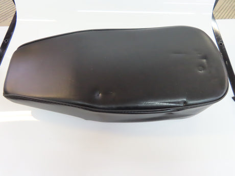 Seat for the Coleman BT200X Mini Bike (Blemished): A black leather seat with a hole, designed specifically for the Coleman BT200X mini bike, resting on a white surface.