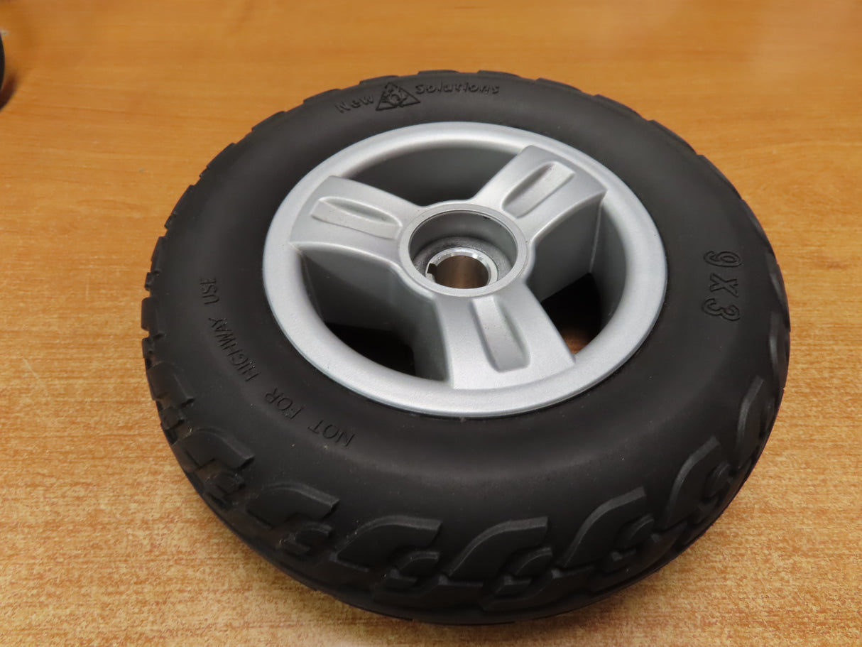 9x3 Black Flat-Free Rear Wheel Assembly for the Go-Go Elite Traveller (Set of 2) (Blemished), featuring a black tire with a silver rim, ideal for small travel-size mobility scooters.