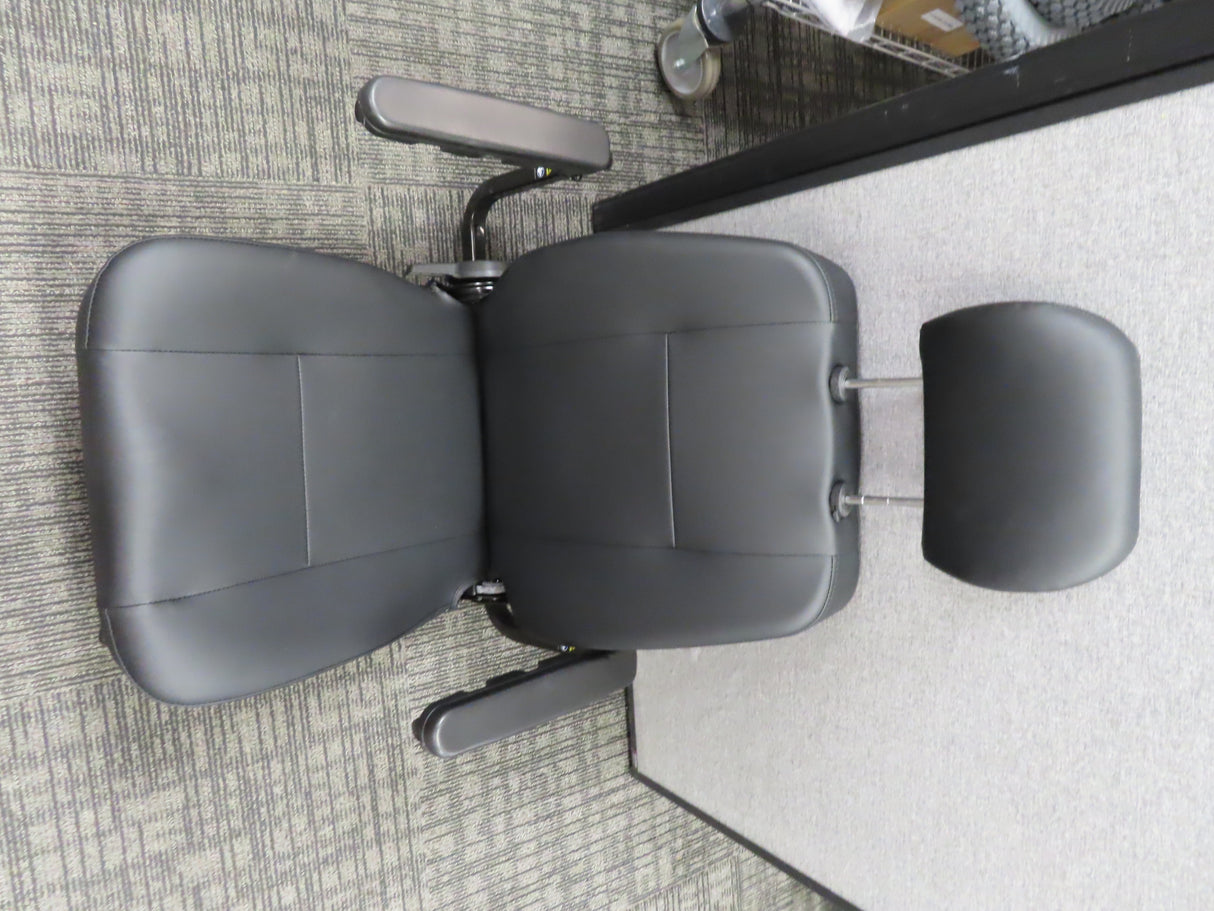 18x18 Black Vinyl Hi-Back Seat Assembly for the Pride Victory 10 (SC610/SC710) & Pursuit (SC713) Scooters: features armrests, headrest, metal legs, and black vinyl upholstery. Includes seat plate, pins, and hardware.