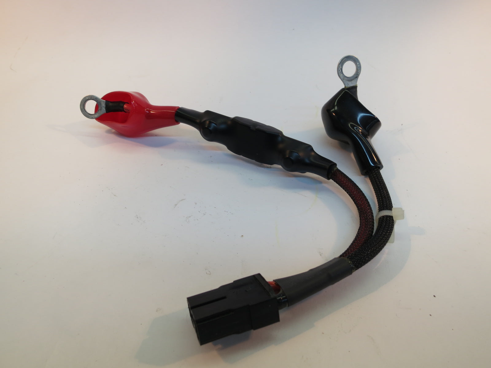 Battery Harness for the Jazzy 614, 614HD, & Quantum Q614 (Used), showing close-up of black and red electrical cables with connectors and metal rings.