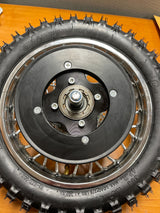 Rear Wheel Assembly for Razor MX500 and MX650 (Blemished): Features a metal rim, black tire, axle, sprocket, brake rotor, freewheel, and visible screws.