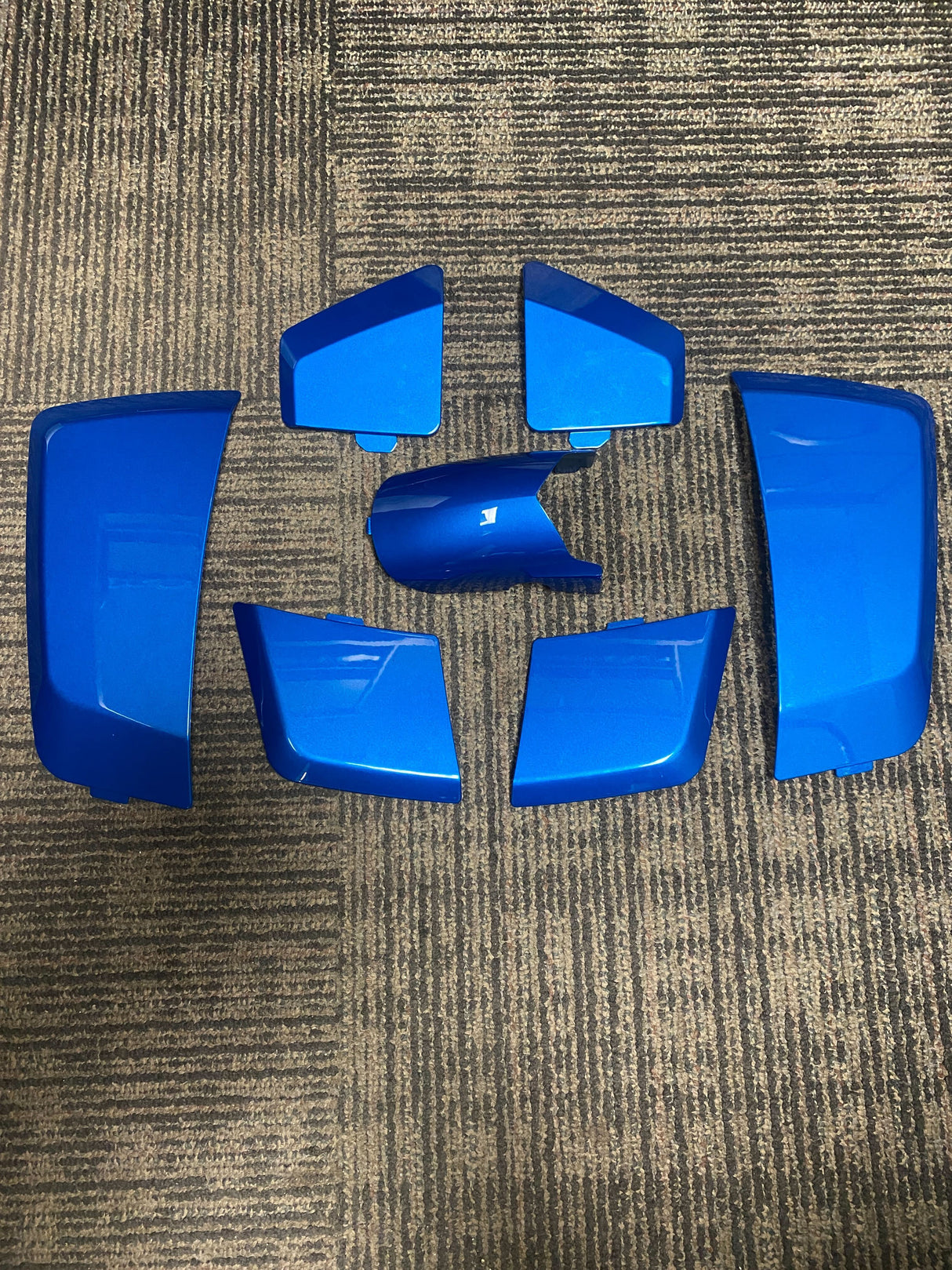 High Capacity Battery Box Shroud Assembly Inserts in Blue for the Go-Go LX (S50LX/S54LX) (Blemished) showing minor scuffs and scratches on blue plastic panels, arranged on a carpet.