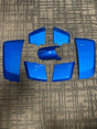 High Capacity Battery Box Shroud Assembly Inserts in Blue for the Go-Go LX (S50LX/S54LX) (Blemished) showing minor scuffs and scratches on blue plastic panels, arranged on a carpet.