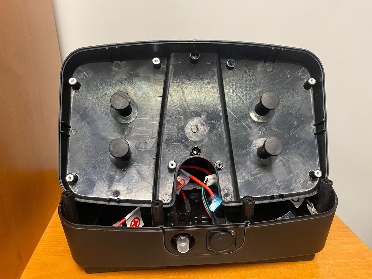 Battery Box for ActiveCare/Drive Medical Spitfire EX & Spitfire Pro SE Scooters (Blemished) showing a black device with buttons, wires, and a missing screw receptacle on the lid.