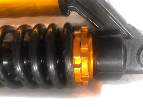 13-1/2 Adjustable Air Shocks for ATVs, Dirt Bikes & Go-Karts (Set of 2) showing black metal springs with orange highlights, designed to enhance ride quality and comfort for powersports vehicles.