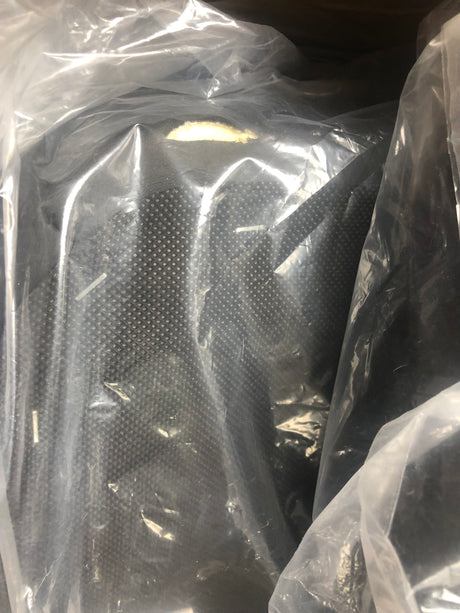 20x20 Black Vinyl Hi-Back Seat Assembly for the Pride Victory 10 & Pursuit Scooters, packaged in a transparent plastic bag showing the black seat components and hardware.