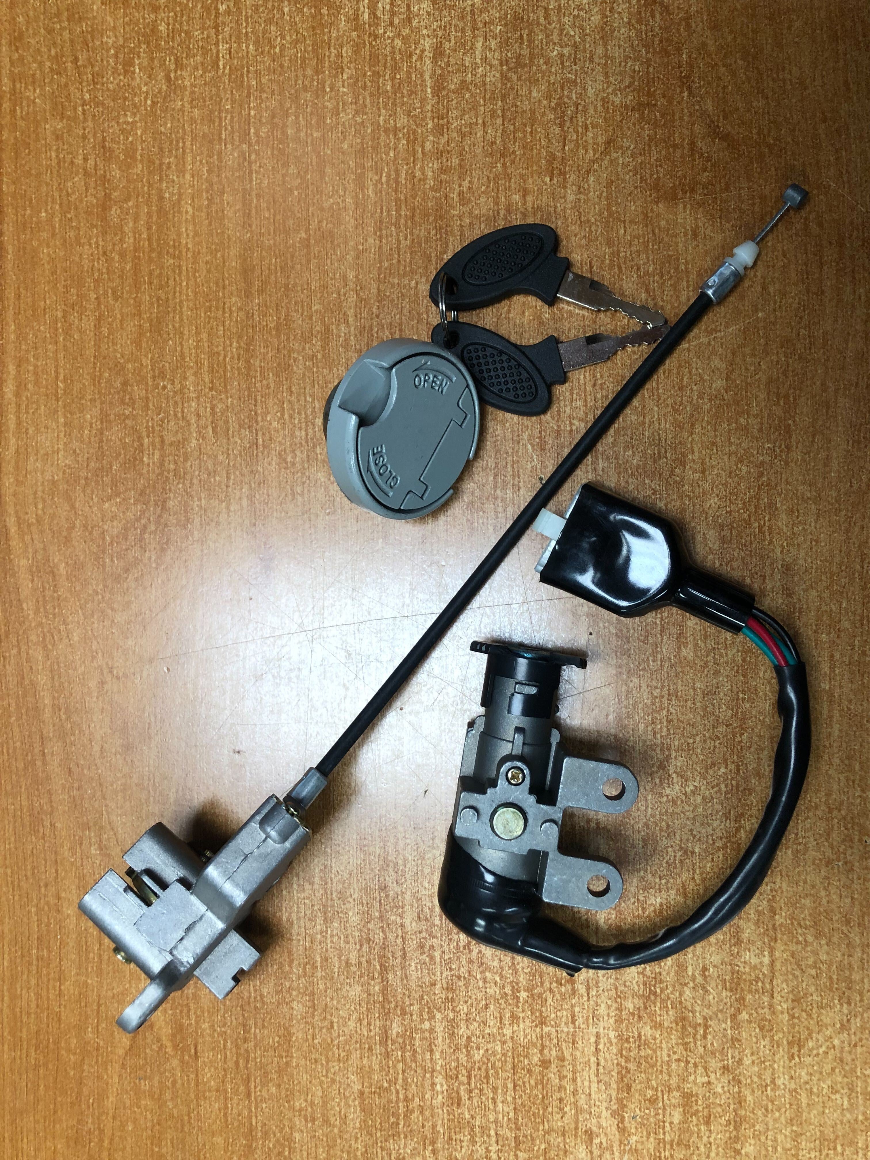 50cc, 125cc, and 150cc Scooter Ignition Module (Key Switch) Complete Assembly with Keys and 5 Pin Connector, featuring keys, key switch cylinder, 5-pin connector, lockable gas cap, and additional parts.