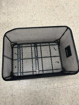 Market-Style Rear Basket for Bicycles (Axiom) on a tile floor, showcasing its black vinyl-dipped steel wire mesh construction and open top design.