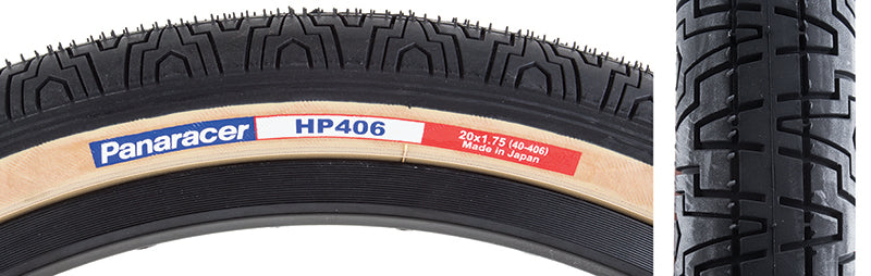 20x1.75 Black HP406 Bicycle Tire showcasing a close-up of the tire's detailed tread and gum walls, highlighting its high-quality flatland design and excellent pavement grip.