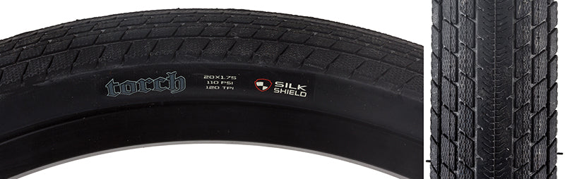 Close-up of the 20x1.75 Torch DC/SS Bicycle Tire, showcasing its lightweight construction and Dual Compound tread for low rolling resistance and extra corner grip, with SilkShield puncture protection.