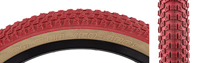 Close-up of the 20x2.0 Red/Tan Cub Bicycle Tire, showcasing its distinctive BMX street tread pattern, a collaboration between Vee Tire and SE Bikes, highlighting vintage styling.