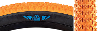 Close-up of the 20x2.0 Orange Cub Bicycle Tire showcasing its classic BMX street tread and durable synthetic rubber compound, designed for versatile performance on all terrain types.