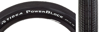 20x2.1 PowerBlock Bicycle Tire, close-up of the black tire showcasing white text and tread pattern, designed for BMX with low rolling resistance and durable, long-lasting UTC Rubber compound.