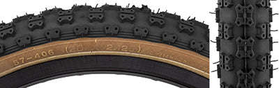 Close-up of the 20x2.125 Black MX3/C714 Bicycle Tire featuring classic knobby BMX tread and skin sidewalls, highlighting the intricate tread pattern and durable sidewall construction.