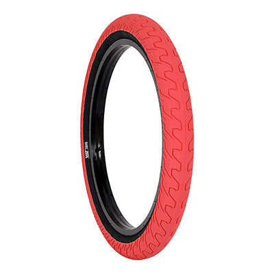 20x2.2 Red Squad Bicycle Tire featuring a micro knurled tread design and black rim, offering a large contact area with minimal rolling resistance.