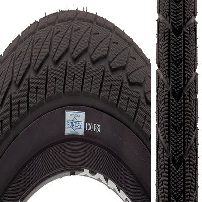 Close-up of a 20x2.25 Current Bicycle Tire showcasing its grippy micro-textured block tread extending to the shoulder, designed for high-pressure use and BMX style.