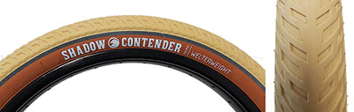 Close-up of the 20x2.35 Cream Contender Welterweight Bicycle Tire showcasing its rugged tread and durable design, ideal for intense street sessions.