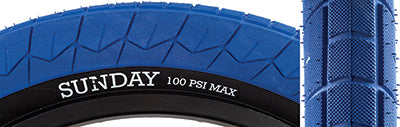 20x2.4 Blue Current V2 Bicycle Tire featuring a close-up of its updated directional grippy tread pattern, designed for enhanced performance for beginners and existing riders.