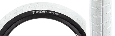 Close-up of the 20x2.4 White Current V2 Bicycle Tire highlighting its directional grippy tread pattern, designed for enhanced bike performance and ease of use for beginner and experienced riders.