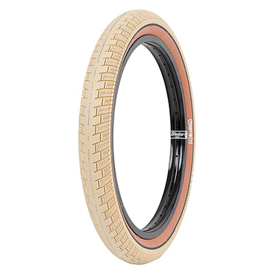 20x2.4 Cream Creeper Bicycle Tire featuring a black rim, brick-shaped tread on the shoulder for grip, and densely packed siping. Designed for street and park use with a strong steel bead and durable rubber.