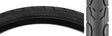 20x1-1/8 Kwest Bicycle Tire close-up showing smooth, rounded tread with large water dispersion grooves, designed for greater speed, traction, and cornering confidence on commutes or recumbent bikes.