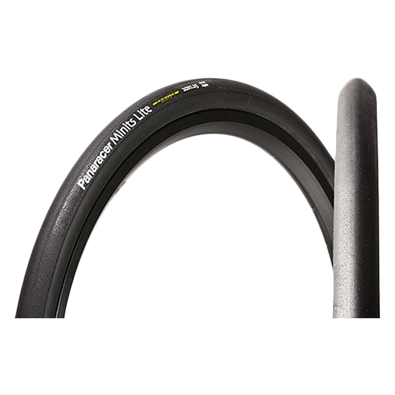 Close-up of the 20x7/8 Minits Light Bicycle Tire, showcasing its black surface with white text, designed for lightweight, fast-rolling performance suitable for commuting or touring.