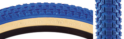 Close-up of the 24x2.0 Blue/Tan Cub Bicycle Tire showcasing its distinct BMX-style street tread, a result of the collaboration between Vee Tire and SE Bikes for vintage-inspired performance.