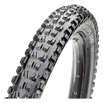 24x2.4 Minion DHF DC Bicycle Tire close-up showing the tread pattern with ramped and channel-cut knobs, designed for low rolling resistance and enhanced grip, emphasizing its straight-line control and precise cornering capabilities.