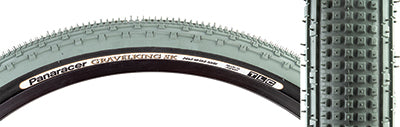 Close-up of a 26x2.1 Olive/Black Gravel King SK Bicycle Tire featuring five rows of square knobs and double rows of continuous ridges for smooth rolling and superior grip on rough or gravel roads.