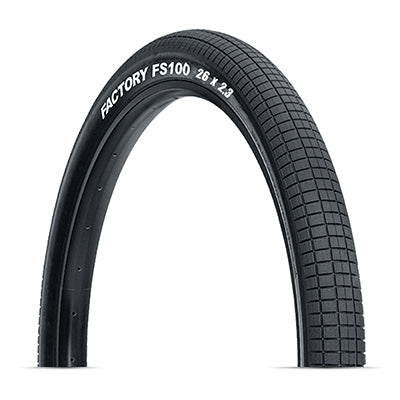 26x2.3 FS100 Bicycle Tire featuring evenly spaced rectangular blocks and knurled surfaces for optimal grip and cornering on streets and parks.